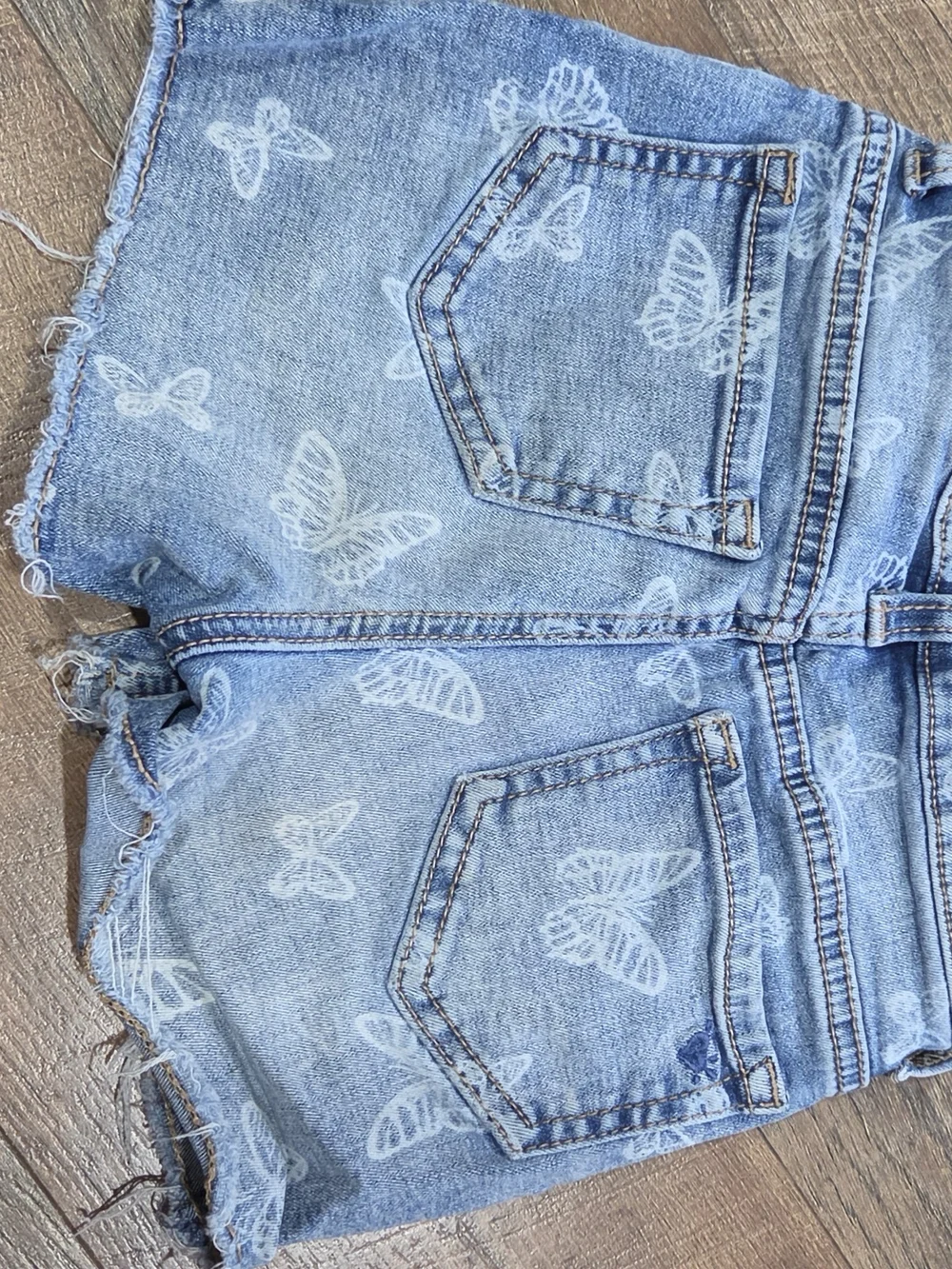 Justice Light Blue Denim Ankle Shorts with White Butterfly Print